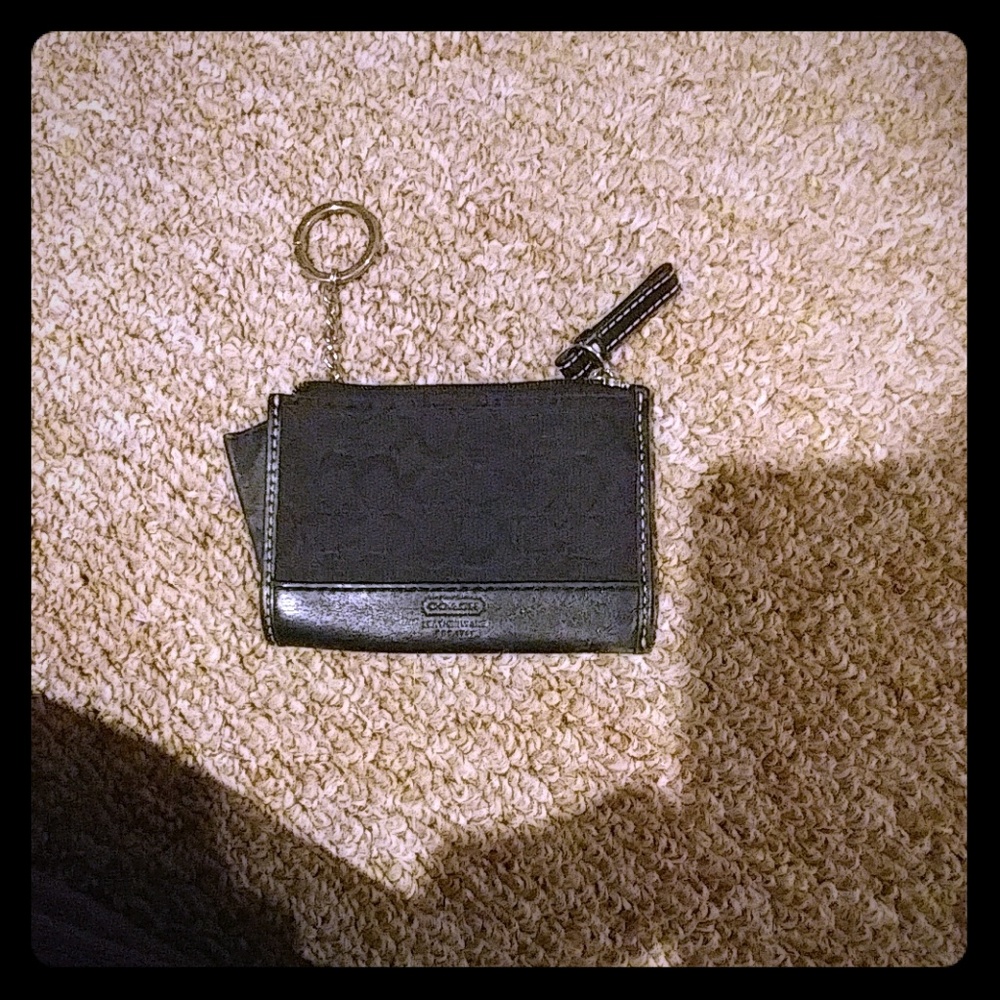 Black coach wallet with attached keyring